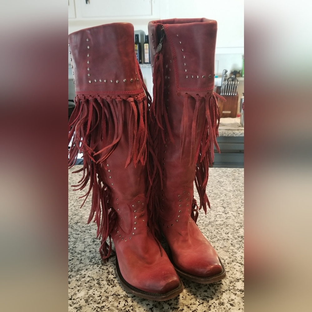 Women's red leather boots with fringe